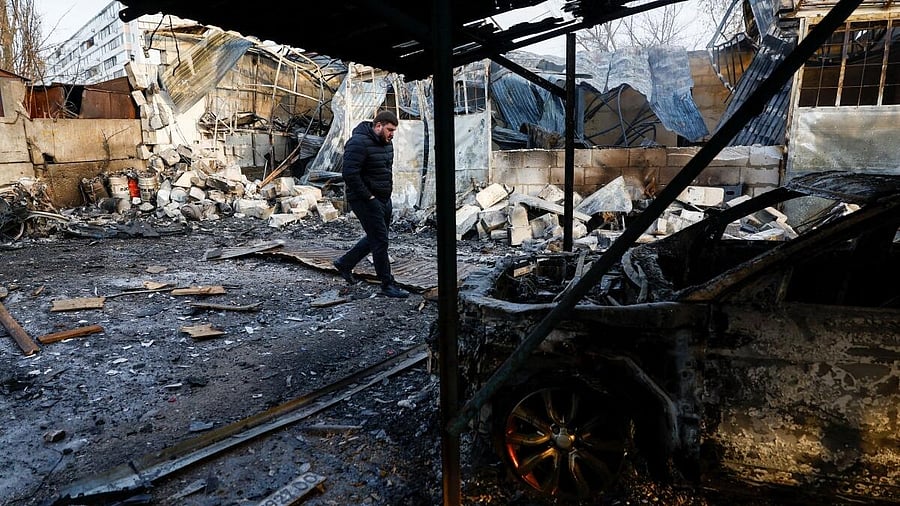 <div class="paragraphs"><p>A resident inspects a compound of car workshop and garage hit during Russian overnight drone and missile strikes, amid Russia's attack on Ukraine, in Kyiv, Ukraine.</p></div>