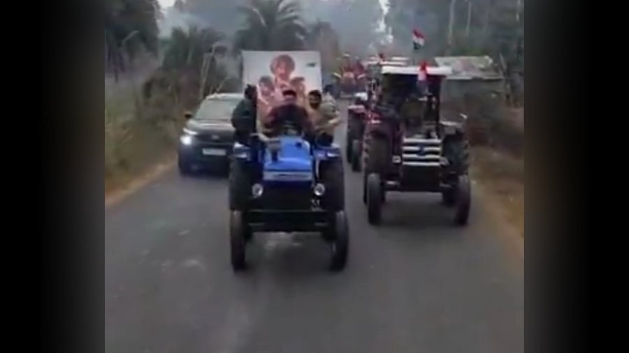 <div class="paragraphs"><p>A screengrab from the video showing fans driving tractors</p></div>