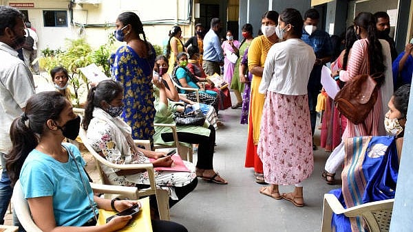 <div class="paragraphs"><p>Students along with their parents waiting  at the Maharani Lakshmi Ammanni PU College for Women at Malleshwara in Bengaluru.</p></div>