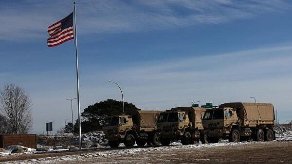 <div class="paragraphs"><p>Minnesota National Guard vehicles parked near the Bishop Henry Whipple Federal Building in Minneapolis, Minnesota, US.</p></div>