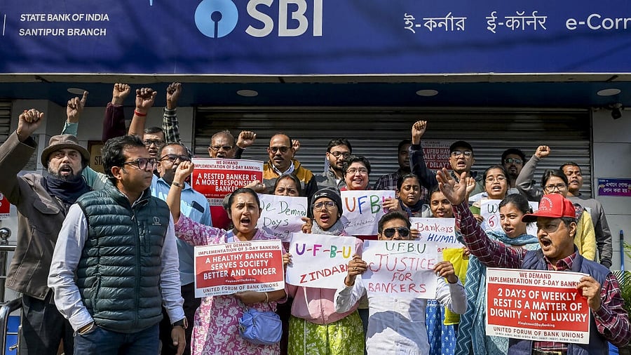 <div class="paragraphs"><p>United Forum of Bank Unions members hold placards during a nationwide strike demanding the implementation of a five-day workweek, in Nadia, West Bengal.</p></div>