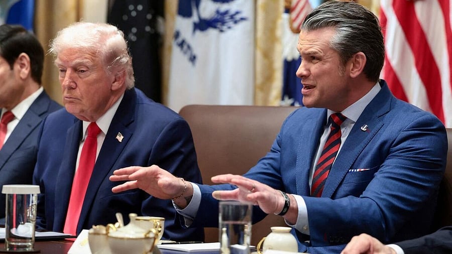 <div class="paragraphs"><p> US Defense Secretary Pete Hegseth speaks next to President Donald Trump</p></div>