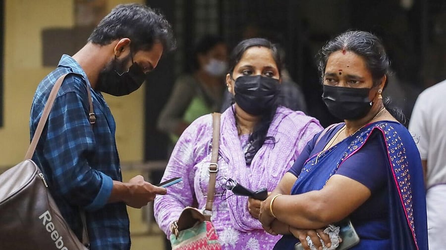 <div class="paragraphs"><p>People wearing safety masks at a hospital after cases of Nipah virus were reported.</p></div>