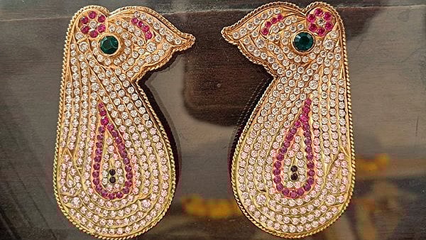 <div class="paragraphs"><p>'The devotee presented a pair of gold ear ornaments studded with precious stones worth about Rs 23 lakh to Sri Padmavathi temple during darshan,' an official release from the temple body said on late Thursday.</p></div>
