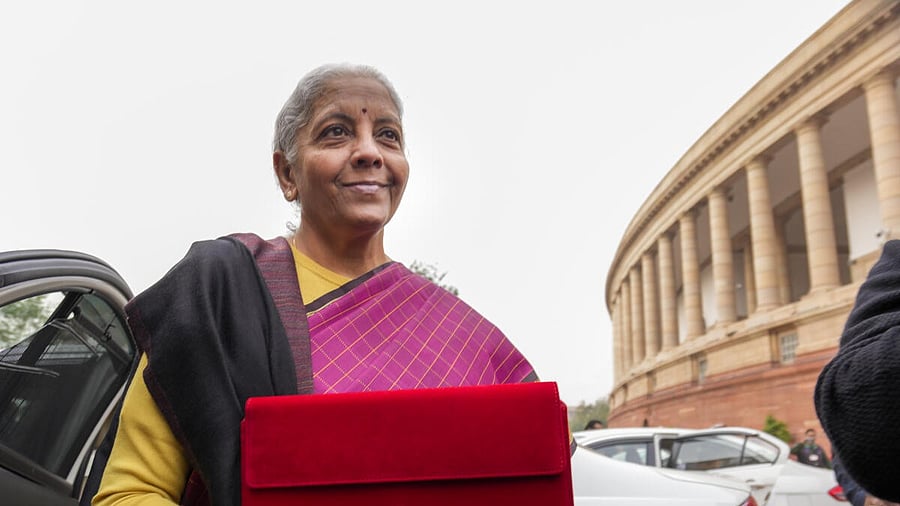 <div class="paragraphs"><p>Finance Minister Nirmala Sitharaman shows the digital tablet, enclosed in a traditional red 'bahi-khata' style pouch</p></div>