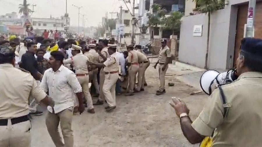 <div class="paragraphs"><p>Police personnel detain people after the house of YSRCP leader and former minister Jogi Ramesh was allegedly vandalised and set on fire by a mob, in Ibrahimpatnam, NTR district, Andhra Pradesh, Sunday, Feb. 1, 2026.</p></div>