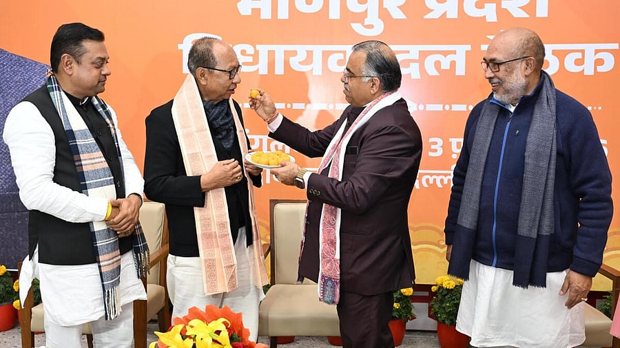 <div class="paragraphs"><p>In this image posted on Feb. 3, 2026, Former minister and Assembly Speaker Yumnam Khemchand Singh with National General Secretary Tarun Chugh and former Manipur CM N Biren Singh after being elected as BJP Legislature Party leader, in New Delhi. BJP MP Sambit Patra is also seen.&nbsp;</p></div>
