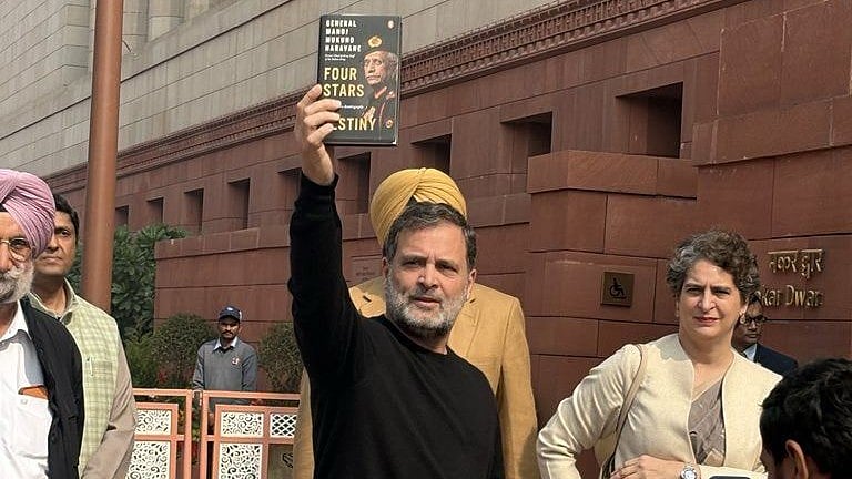 <div class="paragraphs"><p>Rahul Gandhi is seen in this picture holding ex-Army chief's 'memoir'</p></div>