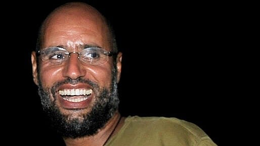 <div class="paragraphs"><p>Saif al-Islam, the son of Libyan leader Muammar Gaddafi, smiles as he greets supporters in Tripoli in this August 23, 2011</p></div>