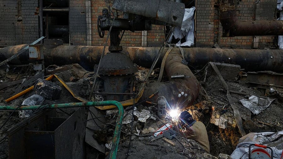 <div class="paragraphs"><p>A worker repairs a pipe at a compound of Darnytsia Thermal Power Plant which was heavily damaged by recent Russian missile and drone strikes, amid Russia's attack on Ukraine.</p></div>