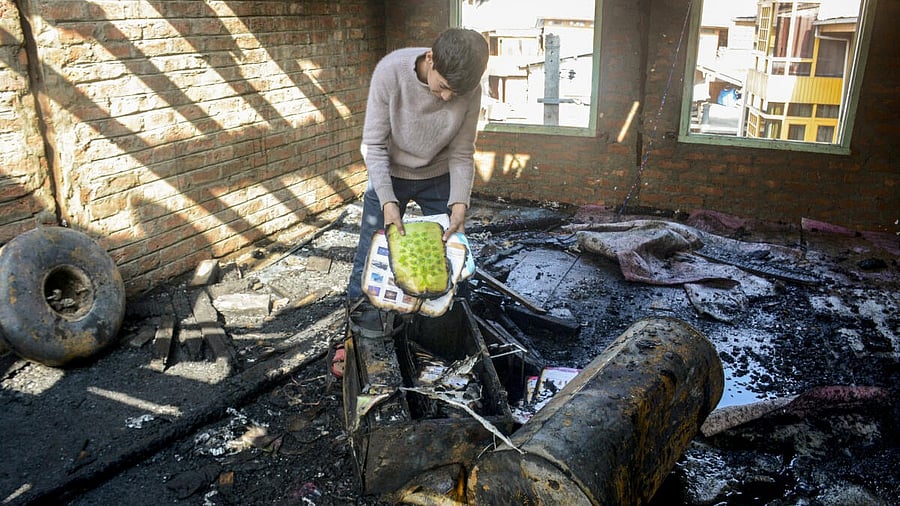 <div class="paragraphs"><p>A boy attempts to retrieve his books from the charred remains of a house </p></div>