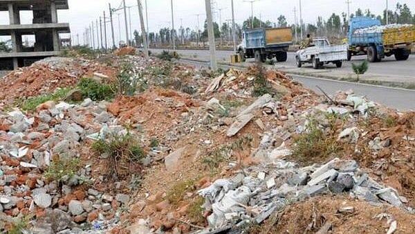 <div class="paragraphs"><p>Construction and demolition waste disposed off unscientifically near Mysuru Ring Road. Image for representation only.</p></div>