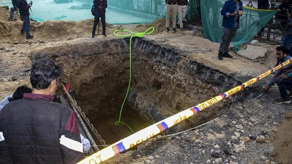 <div class="paragraphs"><p>A 15-foot-deep pit dug for sewage work by the Delhi Jal Board (DJB), where a motorcyclist died after falling, barricaded during investigation by police, at Janakpuri area, in New Delhi.</p></div>