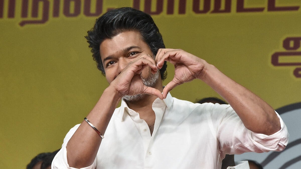 TVK Chief Vijay's Sengol Presentation Sparks Debate on Tamil Nadu Political Strategy