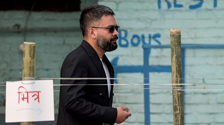 <div class="paragraphs"><p>Balendra Shah, a rapper-turned-politician and the prime ministerial candidate for Rastriya Swatantra Party (RSP), looks on as he queues to vote during the general election in Kathmandu, Nepal</p></div>