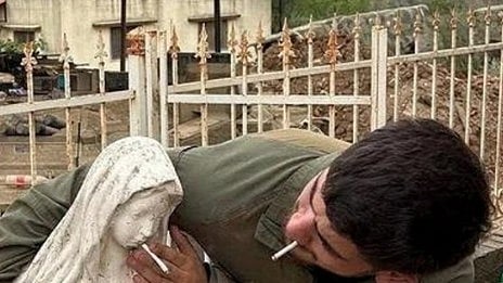 IDF soldier places cigarette in mouth of Virgin Mary statue in Lebanon