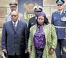 South Africa's fourth President Jacob Zuma, accompanied by his senior wife, Sizakele Khumalo, arrives at the swearing-in ceremony in Pretoria on Satur