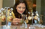 Beautiful: A patron admires the earrings on display. dh photos by Janardhan B K