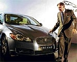 Pride of place: Tata Group and Tata Motors Chairman Ratan Tata poses with a Jaguar XF in Mumbai on Sunday. AFP