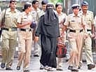 Fahmeeda Syed Mohammed Haneef, one of the convicts in the Mumbai bombings, is escorted by police outside the Byculla Jail before being taken to court