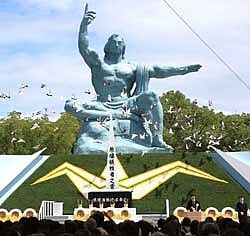 Doves fly around the peace statue at the peace memorial park during the 64th memorial ceremony for atomic bomb victims in Nagasaki on Sunday. AFP