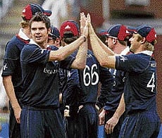 HIGH FIVES: James Anderson (left) celebrates with team-mates after dismissing Tillakaratne Dilshan. AFP