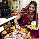 Pious: A woman performing Dhanteras pooja.