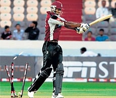 TIMBERRR: Somerset batsman Omari Banks is bowled by NSW Blues Brett Lee during a Champions League T20 match in Hyderabad on Sunday. PTI
