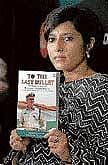 Vinita Kamte displays a book To The Last Bullet written by her in Mumbai on Tuesday. PTI