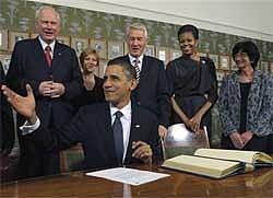 US President Barack Obama talks with Nobel Institute Executive Director Geir Lundestad (left), as first lady Michelle Obama and others look on during a Nobel Signing Ceremony in Oslo on Thursday. AP