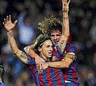 on cloud nine: Barcelona's Zlatan Ibrahimovic (left)                            celebrates with captain Carles Puyol after scoring against Espanyol in Barcelona on Saturday. AFP