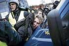 Police arrest activists of the Hit-the-Production demonstration near the Copenhagen Harbour on Sunday. AFP