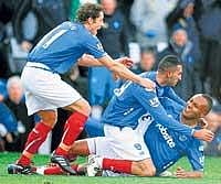 CELEBRATION TIME: Portsmouths Nadir Belhadj (centre) celebrates his goal with team-mates Kaboul (right) and Brown. AP