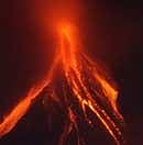 Lava cascades on the slopes of Mayon volcano in Legazpi City, Albay province, southeast of Manila early December 25, 2009, as it continues its mild eruption.