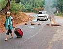 A foreigner walking on the deserted road in Mulky on Tuesday. DH photo