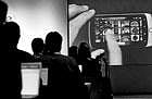 new era in mobile telephony Members of the media watch demos of the Nexus One phones photo application during a news conference at Google headquarters in Mountain View, California, the USA, on Tuesday. AP