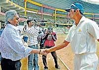 Well done: KSCA President Srikantadatta Narasimharaja Wadeyar greets captain Rahul Dravid after Karnataka secured their Ranji Trophy final spot on Wednesday.