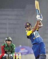 Heave ho: Mahela Jayawardene en route to his 108 on Friday. AFP