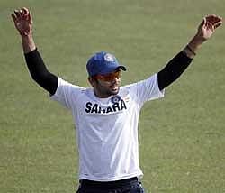 India's Virat Kohli performs stretching exercises during a practice session ahead of the fifth one-day international cricket match of the tri-series in Dhaka, Bangladesh