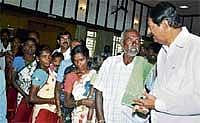 Labour Minister B N Bache Gowda interacting with labourers during a workshop in Bangalore on Tuesday. DH Photo