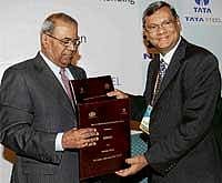 Tata Steel Managing Director H M Nerurkar (left) & NMDC CMD Rana Som exchanging an MoU in Kolkata on Friday. PTI