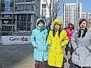 Women in colourful jackets walk past the Google sign outside the Googles China headquarters in Beijing on Friday. AP