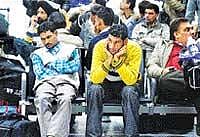 Passengers wait for their delayed flights at the Indira Gandhi International Airport in New Delhi on Wednesday. AP