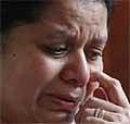 Anoma Fonseka, wife of the Sri Lanka's defeated presidential candidate and former military chief Sarath Fonseka, reacts as she speaks to the media at her residence in Colombo, Sri Lanka, Tuesday. AP