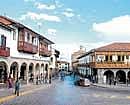 Heart of the city: Many houses and shops dot the Plaza de Armas Cuzcos main square. Photo by Indranil Choudhuri