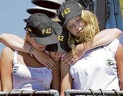 Survivors of the capsized Canadian Concordia sailing ship are seen arriving at the Mocangue Brazilian navy base in Rio de Janeiro, Brazil, on Saturday. A Brazilian navy spokesman said 64 people, most of them students from Canadas West Island College, were rescued after the three-masted tall ship Concordia sank 550 km off the Brazilian coast southeast of Rio de Janeiro. AFP