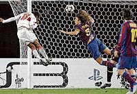 heading home: VfB Stuttgarts Cacau (left) scores against Barcelona during their Champions League last-16 first leg clash on Tuesday. AP