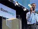 Enterprising: Bloom Energy CEO K R Sridhar holds a fuel cell as he speaks during a Bloom Energy product launch at the eBay headquarters in San Jose, California. Bloom Energy, a Silicon Valley start-up, introduced the 'Bloom Box', a solid oxide fuel cell device that can generate electricity at a cost of 8 to 10 cents per kilowatt hour using natural gas. AFP