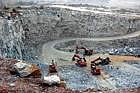 querry on quarry: Quarrying in progress on a hill in Vakkaleri Hobli. (Inset) Doddayyur villagers showing the rocks blasted on Anjanadri Hill. dh photo