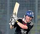Englands Eoin Morgan hits a boundary during his unbeaten century against Bangladesh on Tuesday. REUTERS